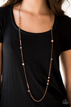 Load image into Gallery viewer, Varying in size and shimmer, pearly copper beads trickle along mismatched sections of copper chain in a refined fashion. Crystal-like beads dangle from the chain, creating flashes of asymmetrical sparkle. Features an adjustable clasp closure.  Sold as one individual necklace. Includes one pair of matching earrings.
