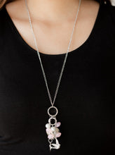 Load image into Gallery viewer, A silver bird charm, silver heart charms, and collection of white pearls and opaque pink crystal-like beads swing from the bottom of a lengthened silver chain for a whimsically clustered look. Features an adjustable clasp closure.  Sold as one individual necklace. Includes one pair of matching earrings.  