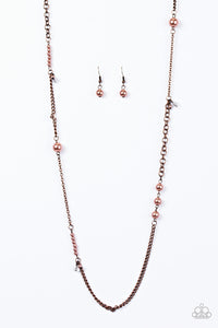 Varying in size and shimmer, pearly copper beads trickle along mismatched sections of copper chain in a refined fashion. Crystal-like beads dangle from the chain, creating flashes of asymmetrical sparkle. Features an adjustable clasp closure.  Sold as one individual necklace. Includes one pair of matching earrings.