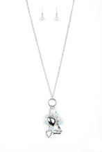 Load image into Gallery viewer, A silver bird charm, silver heart charms, and collection of white pearls and opaque blue crystal-like beads swing from the bottom of a lengthened silver chain for a whimsically clustered look. Features an adjustable clasp closure.  Sold as one individual necklace. Includes one pair of matching earrings.