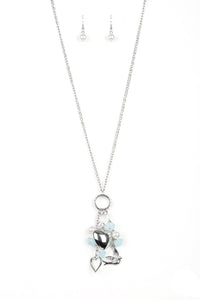 A silver bird charm, silver heart charms, and collection of white pearls and opaque blue crystal-like beads swing from the bottom of a lengthened silver chain for a whimsically clustered look. Features an adjustable clasp closure.  Sold as one individual necklace. Includes one pair of matching earrings.