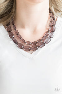 Infused with dainty gunmetal beads, smoky emerald-cut beads layer below the collar for an edgy look. Features an adjustable clasp closure.  Sold as one individual necklace. Includes one pair of matching earrings.  Always nickel and lead free.