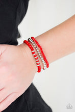Load image into Gallery viewer, A collection of faceted red and silver beads are threaded along stretchy bands around the wrist. White rhinestone encrusted rings are added to one strand for a refined finish.  Sold as one set of three bracelets.  Always nickel and lead free.