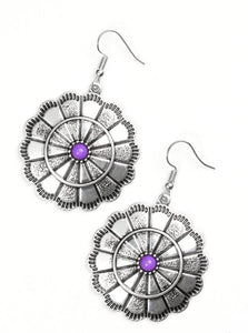 Shimmery silver petals bloom from a vivacious purple center for a seasonal look. Etched in serrated edges, alternating petals have been delicately hammered in texture, adding depth and shimmer to the whimsical frame. Earring attaches to a standard fishhook fitting.  Sold as one pair of earrings.