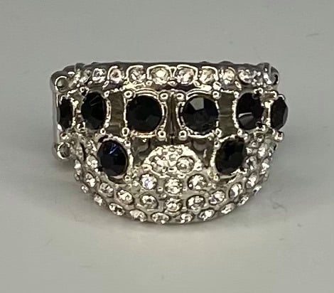 A White rhinestone crown adorned by black gems.  Sold as one individual ring.  Always nickel and lead free.  Fashion Fix May 2021 Exclusive