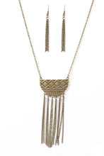 Load image into Gallery viewer, Embossed in radiating sunburst patterns, a tribal inspired pendant swings from the bottom of a glistening brass chain for a seasonal look. Dainty brass chains stream from the bottom of the crescent-shaped pendant, adding a wanderlust vibe to the indigenous look. Features an adjustable clasp closure.  Sold as one individual necklace. Includes one pair of matching earrings.