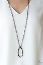 Load image into Gallery viewer, A bold gunmetal pendant swings from the bottom of mismatched silver and gunmetal chains, creating an edgy mixed metallic palette. Features an adjustable clasp closure.  Sold as one individual necklace. Includes one pair of matching earrings.  Always nickel and lead free.