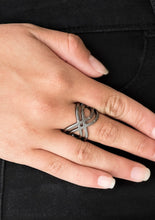 Load image into Gallery viewer, Brushed in a high-sheen finish, glistening gunmetal bars ripple across the finger, coalescing into a whimsical infinity frame. Features a stretchy band for a flexible fit.  Sold as one individual ring.  Always nickel and lead free.