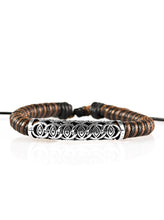 Load image into Gallery viewer, Brown and black cording knots around a leather cord, creating a colorful urban piece around the wrist. An ornate silver bead slides along the colorful strand, creating a bold centerpiece. Features an adjustable sliding knot closure. Sold as one individual bracelet.