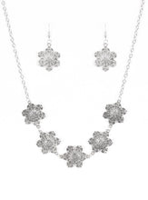 Load image into Gallery viewer, Featuring filigree filled petals, glistening silver flowers link below the collar in a seasonal fashion. Features an adjustable clasp closure.  Sold as one individual necklace. Includes one pair of matching earrings.