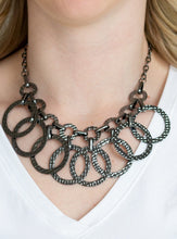 Load image into Gallery viewer, Hammered gunmetal hoops swing from the bottom of interconnected hammered links, creating an edgy industrial fringe below the collar. Features an adjustable clasp closure.  Sold as one individual necklace. Includes one pair of matching earrings.  