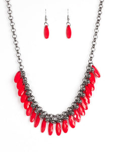 Faceted red teardrops and glistening gunmetal beads swing from the bottom of interlocking gunmetal chains, creating a spunky fringe below the collar. Features an adjustable clasp closure.  Sold as one individual necklace. Includes one pair of matching earrings.