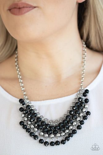 A colorful cascade of polished black and shimmery silver beads dangle from interlocking silver chains, creating a stacked fringe below the collar. Features an adjustable clasp closure.  Sold as one individual necklace. Includes one pair of matching earrings. 