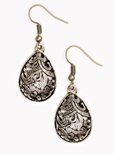 Etched in shimmer, brass vine-like filigree climbs a brass teardrop for a tribal inspired look. Earring attaches to a standard fishhook fitting.  Sold as one pair of earrings.