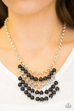 Load image into Gallery viewer, Earthy black stone beads swing from the bottom of a netted silver chain, creating a bold artisanal fringe below the collar. Features an adjustable clasp closure.  Sold as one individual necklace. Includes one pair of matching earrings.  Always nickel and lead free.