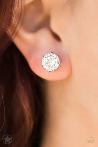 A sparkling white rhinestone is nestled inside a classic silver frame for a timeless look. Earring attaches to a standard post fitting.  Sold as one pair of post earrings.  Always nickel and lead free.