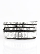 Load image into Gallery viewer, Encrusted in mismatched sparkle, half of a black suede band is encrusted in white emerald style cut rhinestones, while the other half splits into three separate bands encrusted in white rhinestones for a sassy look. The elongated band allows for a trendy double wrap design. Features an adjustable snap closure.  Sold as one individual bracelet.