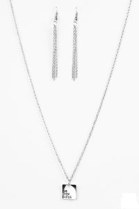 The phrase, “be you tiful” adorns the corner of a shiny silver square, creating an inspiring minimalistic design. Features an adjustable clasp closure.  Sold as one individual necklace. Includes one pair of matching earrings.