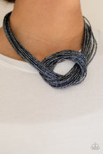 Load image into Gallery viewer, Countless strands of metallic blue seed beads delicately knot together below the collar to create an unforgettable statement piece. Features an adjustable clasp closure.  Sold as one individual necklace. Includes one pair of matching earrings.  Always nickel and lead free.
