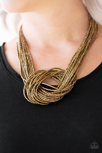 Countless strands of brass seed beads delicately knot together below the collar to create an unforgettable statement piece. Features an adjustable clasp closure.  Sold as one individual necklace. Includes one pair of matching earrings.  Always nickel and lead free.