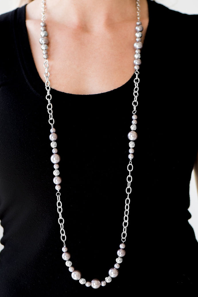 Sections of classic silver beads and pearly silver beads trickle along a shimmery silver chain for a refined look. Features an adjustable clasp closure.  Sold as one individual necklace. Includes one pair of matching earrings.  