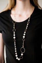 Load image into Gallery viewer, Luminescent pearls and classic gold beads join shimmery gold hoops along a gold chain for a timeless look. Features an adjustable clasp closure.  Sold as one individual necklace. Includes one pair of matching earrings.  