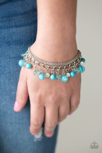 Infused with layers of mismatched silver chains, glassy, polished blue, and glittery white rhinestones swing from the wrist in a whimsical fashion. Features an adjustable clasp closure.  Sold as one individual bracelet.  Always nickel and lead free.
