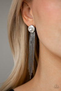 Flat gunmetal chains stream from the bottom of a solitaire white gem, creating a dramatically tapered fringe. Earring attaches to a standard post fitting.  Sold as one pair of post earrings.   Always nickel and lead free. 
