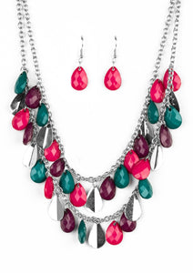 Two strands of silver chain are decorated in a flirtatious fringe of faceted green, pink, and plum teardrops. Glittery beveled silver teardrops are sprinkled between the colorful beading, adding hints of shimmer to the vibrant design. Features an adjustable clasp closure.  Sold as one individual necklace. Includes one pair of matching earrings.