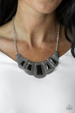 Load image into Gallery viewer, Featuring faceted emerald style cuts, bold geometric black beads are pressed into studded silver frames that dramatically link below the collar for a fierce finish. Features an adjustable clasp closure.  Sold as one individual necklace. Includes one pair of matching earrings.  Always nickel and lead free.