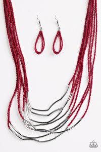 Infused with two large silver fittings, shiny red seed beads are threaded along countless strands, creating dramatic layers below the collar. Shimmery silver accents slide along the centers of the strands, adding depth and shimmer to the seasonal palette. Features an adjustable clasp closure.  Sold as one individual necklace. Includes one pair of matching earrings.   