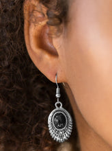 Load image into Gallery viewer, A shiny black bead is pressed into the center of an ornate silver frame. Glittery hematite rhinestones are sprinkled along the textured frame, adding a refined shimmer to the seasonal palette. Earring attaches to a standard fishhook fitting.  Sold as one pair of earrings.