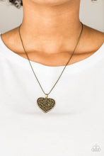 Load image into Gallery viewer, Filled with vine-like filigree detail, a brass heart pendant swings below the collar for a vintage inspired look. Features an adjustable clasp closure.  Sold as one individual necklace. Includes one pair of matching earrings.  Always nickel and lead free.