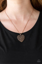 Load image into Gallery viewer, Filled with vine-like filigree detail, a copper heart pendant swings below the collar for a vintage inspired look. Features an adjustable clasp closure.  Sold as one individual necklace. Includes one pair of matching earrings.  Always nickel and lead free.