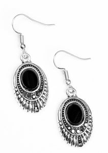 A shiny black bead is pressed into the center of an ornate silver frame. Glittery hematite rhinestones are sprinkled along the textured frame, adding a refined shimmer to the seasonal palette. Earring attaches to a standard fishhook fitting.  Sold as one pair of earrings.