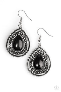 A hearty black bead is pressed into the center of a textured silver teardrop, creating a seasonal inspired look