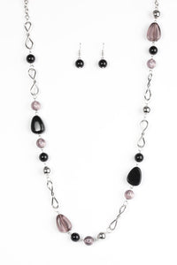 Black and polished black beading trickles along a shimmery silver chain. Classic silver beads and twisting silver accents are sprinkled between the colorful beading, adding shimmery hints to the whimsical palette. Features an adjustable clasp closure.  Sold as one individual necklace. Includes one pair of matching earrings.