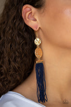Load image into Gallery viewer, A collection of Evening Blue cording streams from the bottom of stacked hammered gold discs, creating a whimsical tassel. Earring attaches to a standard fishhook fitting.  Sold as one pair of earrings.  Always nickel and lead free.