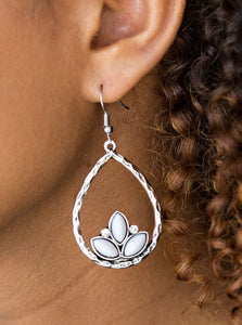 Shiny gray beads adorn the bottom of a hammered silver teardrop, coalescing into a whimsical lotus pattern. Dainty white rhinestones flank the shiny beads for a refined finish. Earring attaches to a standard fishhook fitting.  Sold as one pair of earrings.