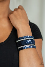 Load image into Gallery viewer, Infused with strands of blinding white rhinestones, row after row of shimmery sequins are stitched across the front of a spliced black suede band. Bracelet features reversible sequins that change from silver to blue. Features an adjustable snap closure.  Sold as one individual bracelet.  Always nickel and lead free.