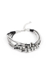 Load image into Gallery viewer, Multiple strands of black cord are fitted with long, curved cylinders that meet in the middle. The sliding bars are separated by small antiqued silver loops that mimic pipe fittings, making this a perfect addition to any industrial look. Features an adjustable clasp closure.