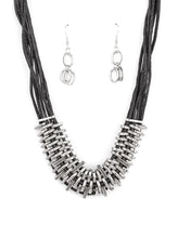 Load image into Gallery viewer,  Bold and unapologetic, this hefty necklace gives off a hand-made feel with its multiple strands of black cording held together by industrial silver fittings that shift and slide. Features an adjustable clasp closure.