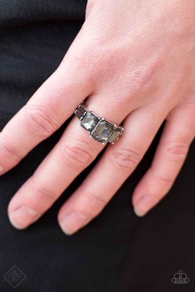 Featuring edgy emerald style cuts, a row of smoky gems is pressed into an antiqued silver band for a regal look. Features a dainty stretchy band for a flexible fit.  Sold as one individual ring.  Always nickel and lead free.