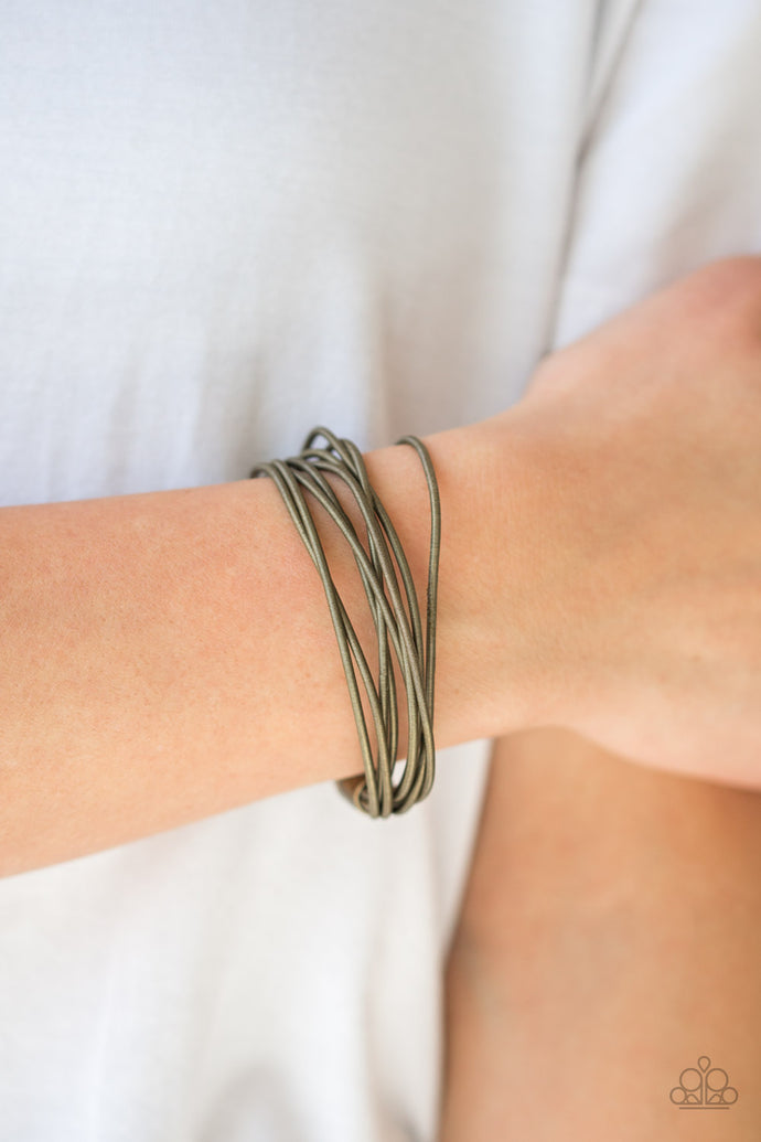 Brass spring-like wires layer across the wrist for a sleek industrial look. Features a magnetic closure.  Sold as one individual bracelet.  Always nickel and lead free. 