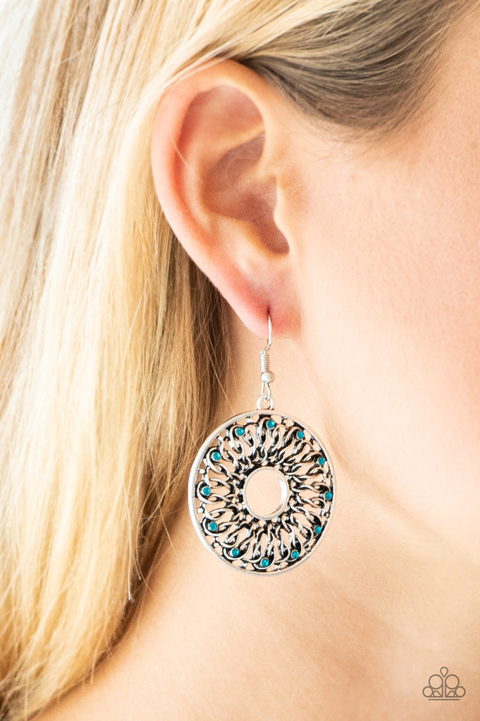 Dotted in dainty blue rhinestones, glistening silver wires twist and interlock inside of a shimmery silver hoop for a whimsical look. Earring attaches to a standard fishhook fitting.  Sold as one pair of earrings.  Always nickel and lead free. 