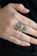 Load image into Gallery viewer, Stamped and studded in tribal inspired patterns, a thick silver frame folds around the finger. Glassy tiger&#39;s eye stones are pressed down the ornate frame for a colorful finish. Features a stretchy band for a flexible fit.  Sold as one individual ring.  Always nickel and lead free.