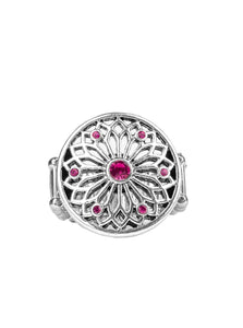 Glittery pink rhinestones are sprinkled across a shimmery floral center, creating a whimsical mandala-like frame atop the finger. Features a stretchy band for a flexible fit.  Sold as one individual ring.