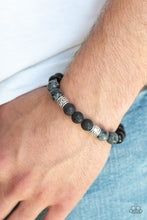 Load image into Gallery viewer, Infused with ornate silver beads, a collection of polished black beads, black lava rock beads, and brown stone beads are threaded along a stretchy band around the wrist for a seasonal look.  Sold as one individual bracelet.  Always nickel and lead free. 