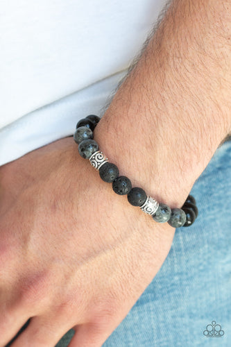 Infused with ornate silver beads, a collection of polished black beads, black lava rock beads, and brown stone beads are threaded along a stretchy band around the wrist for a seasonal look.  Sold as one individual bracelet.  Always nickel and lead free. 