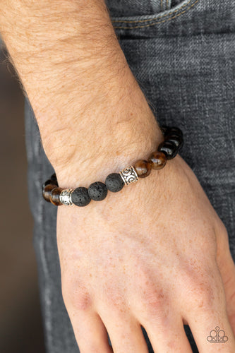 ESSENTIAL OIL ALERT!!!  Infused with ornate silver beads, a collection of polished black beads, black lava rock beads, and brown stone beads are threaded along a stretchy band around the wrist for a seasonal look.  Sold as one individual bracelet.  Always nickel and lead free. 